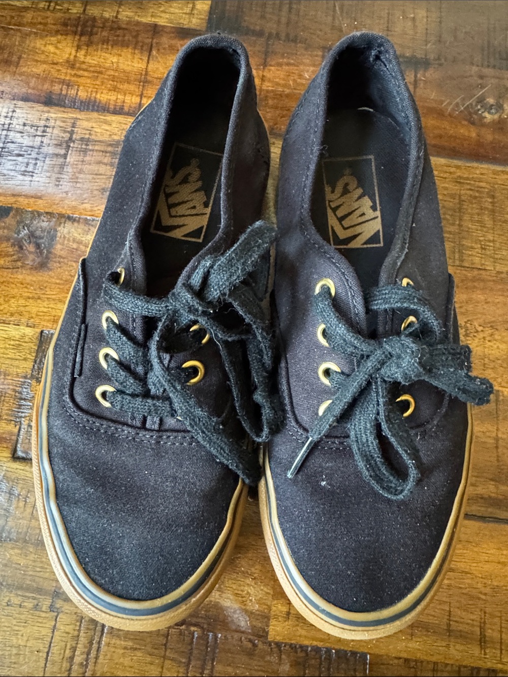 Vans women’s Black Canvas Low-Top Sneakers with Gum Sole